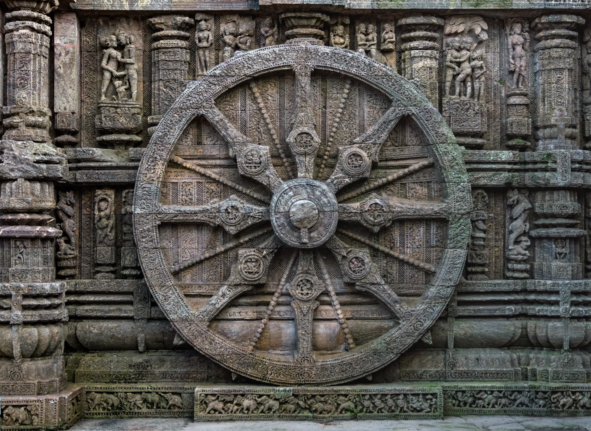 An intricately carved stone wheel at the Konark Sun Temple in Odisha