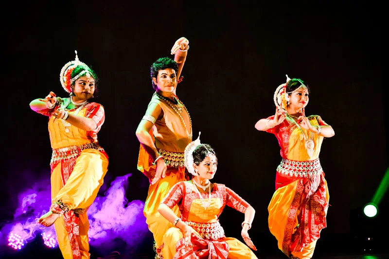 An Odissi dancer performing in traditional costume and jewellery