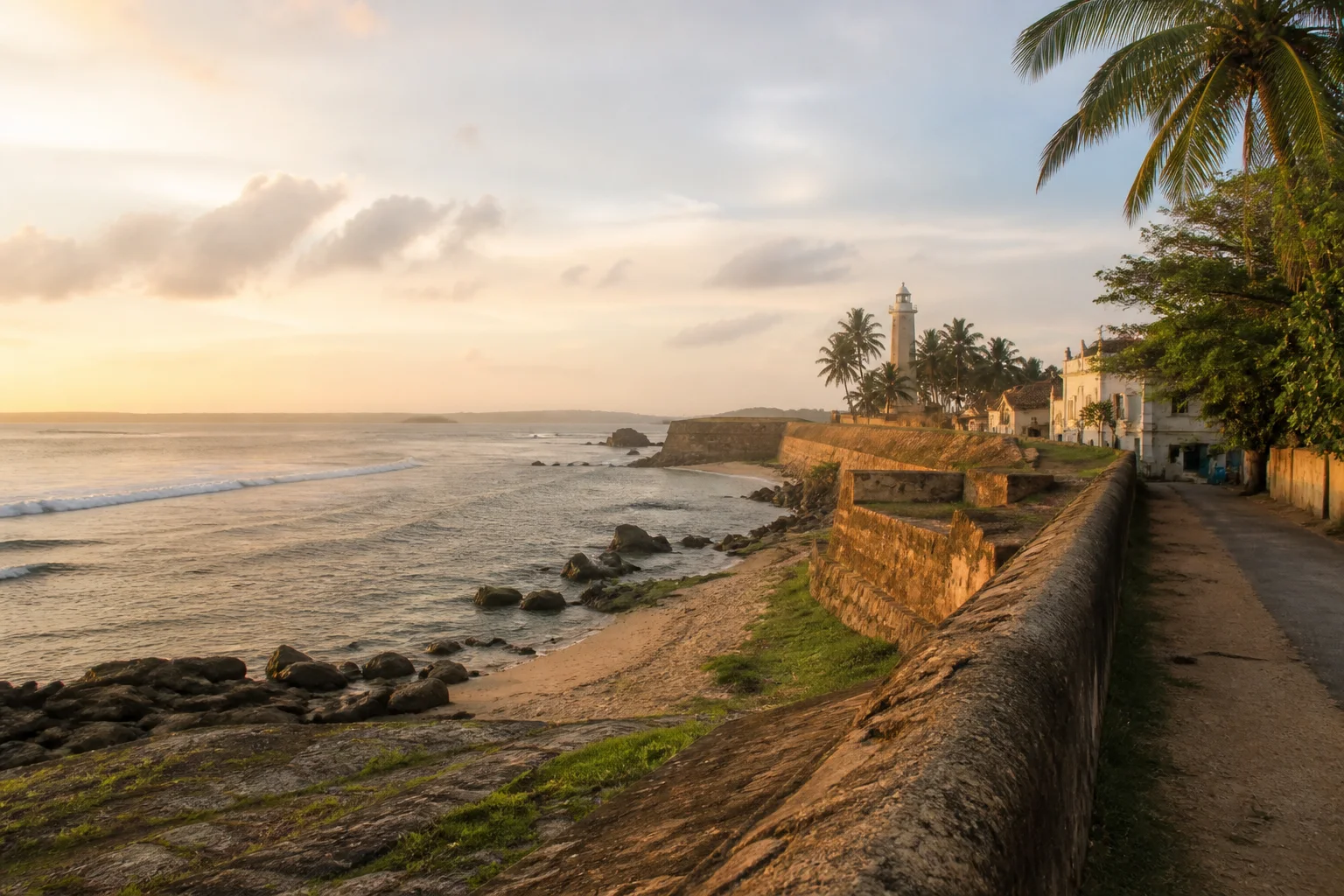 The historic walls and tropical coast of Galle at dawn